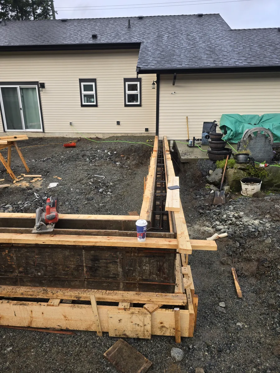 Outdoor construction framing and site preparation for deck and yard project